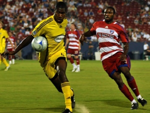 Columbus Crew's Andy Iro, left, controls the ball as FC Dallas' Jeff Cunningham, right moves in during a MLS soccer game in Frisco, Texas on Saturday, Aug. 30, 2008. (AP Photo/Dallas Morning News, Mark M. Hancock)