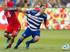 FC Dallas' Daniel Hernandez, right, and Toronto FC's Mikael Yourassowsky battle for the ball during first half MLS action in Toronto Wednesday, July 20, 2011. (THE CANADIAN PRESS/Darren Calabrese)