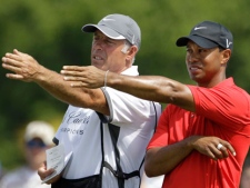 This March 13, 2011, file photo shows Tiger Woods' caddie Steve Williams, left, and Woods, right, lining up a putt on the fourth hole during the final round at the Cadillac Championship golf tournament, in Doral, Fla. Woods has decided to get rid of Williams as his caddie. Woods announced on his website Wednesday, July 20, 2011, that he and Williams, who have been together since March 1999, will no longer be working together. (AP Photo/Lynne Sladky)