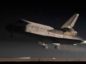 Space shuttle Atlantis lands at the Kennedy Space Center in Cape Canaveral, Fla., Thursday, July 21, 2011. The landing of Atlantis brings the space shuttle program to an end. (AP Photo/John Raoux)