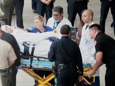 This May 16, 2011 file photo shows San Francisco Giants fan Bryan Stow being transported to San Francisco General Hospital from Los Angeles.  (AP Photo/Damian Dovarganes)