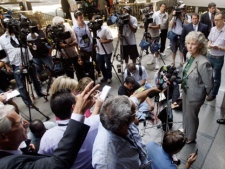 Los Angeles District Attorney spokeswoman Sandi Gibbons, talks to reporters after arraignment was postponed for two Southern California men charged with severely beating a San Francisco Giants fan on opening day of this year's baseball season.(AP Photo/Reed Saxon)