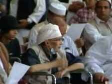 In this image taken from Libya's state TV, during a broadcast showing convicted Lockerbie bomber Abdel Baset al-Megrahi attending a pro-government rally in the Libyan capital of Tripoli on Tuesday July 26, 2011. (AP Photo/Libya State TV)