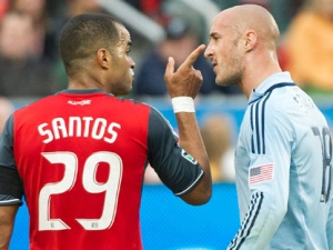 Toronto FC forward Maicon Santos (29) points at Sporting Kansas City defender Aurelien Collin, right, during first half MLS soccer action in Toronto on Saturday, June 4, 2011. (THE CANADIAN PRESS/Nathan Denette)