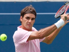 Roger Federer of Switzerland returns the ball during the final of Rogers Cup ATP tennis action in Toronto on August 15, 2010. It will be a new-look Rogers Cup this year with Toronto and Montreal each hosting tournaments during the same week. "Clearly I think it's a bit unfortunate for Canada to have two big events like this at the very same time," he said Wednesday Aug. 3, 2011. (THE CANADIAN PRESS/ Nathan Denette)