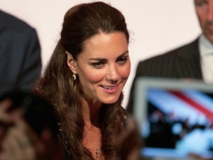 Kate, the Duchess of Cambridge, smiles as she speaks with members of the crowd at the Service Nation: Mission Serve "Hiring Our Heroes Los Angeles" job fair event at Sony Pictures Studios, Sunday, July 10, 2011, in Culver City, Calif. (AP Photo/Bret Hartman)