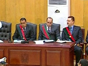 State prosecutors work during the trial of former Egyptian President Hosni Mubarak in a Cairo courtroom, Wednesday, Aug. 3, 2011. (Egyptian State TV)