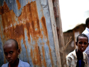 Somali children stand outside a mosque at the start of Friday prayers in a refugee camp outside Dadaab, eastern Kenya, 100 kms (60 miles) from the Somali border, Friday Aug. 5, 2011. The drought and famine in the horn of Africa has killed more than 29,000 children under the age of 5 in the last 90 days in southern Somalia alone, according to U.S. estimates. The U.N. says 640,000 Somali children are acutely malnourished, suggesting the death toll of small children will rise. (AP Photo/Jerome Delay)