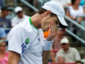 Andy Murray from Great Britain reacts during his match against Kevin Anderson of South Africa at the Rogers Cup tennis tournament Tuesday, August 9, 2011 in Montreal. Anderson won 6-3, 6-1. (THE CANADIAN PRESS/Paul Chiasson)