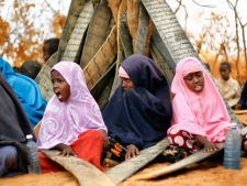 Somali girls recite verses of the Koran at an outdoor madrasa at the Ifo camp outside Dadaab, Eastern Kenya, 100 kms (60 miles) from the Somali border, Tuesday Aug. 9, 2011. U.S. President Barack Obama has approved $105 million for humanitarian efforts in the Horn of Africa to combat worsening drought and famine. The drought and famine in the horn of Africa has killed more than 29,000 children under the age of 5 in the last 90 days in southern Somalia alone, according to U.S. estimates. The U.N. says 640,000 Somali children are acutely malnourished, suggesting the death toll of small children will rise. (AP Photo/Jerome Delay)