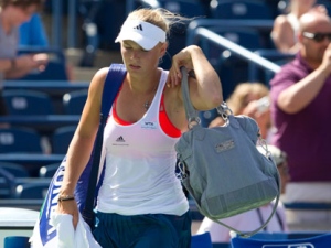 Caroline Wozniacki of Denmark leaves the court after being upset by Roberta Vinci of Italy at the Rogers Cup women's tennis tournament in Toronto Wednesday, August 10, 2011. (THE CANADIAN PRESS/Darren Calabrese)