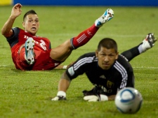 Toronto FC 's Peri Marosevic (left) and Real Salt Lake's Nick Rimando watch Joao Plata's shot slide into the net during second half MLS action in Toronto on Saturday August 13, 2011. (THE CANADIAN PRESS/Chris Young)