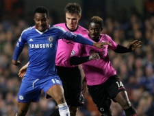 Chelsea's John Obi Mikel, left, goes for the ball with FC Copenhagen's Claudmir, centre and Dame N'Doye during a Champions League round of 16 match at Chelsea's Stamford Bridge stadium in London, Wednesday, March, 16, 2011.(AP Photo/Sang Tan)