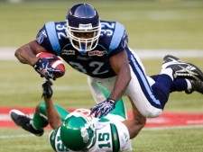 Toronto Argonauts running back Andre Durie (32) is tackled by Saskatchewan Roughriders defensive back Lance Frazier (15) during first half CFL action in Toronto on Thursday August 18, 2011. THE CANADIAN PRESS/FRANK GUNN