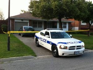 A Peel Regional Police vehicle sits outside a Deerfield Crescent home in Brampton, where 42-year-old Raquel Junio was abducted early Thursday, Aug. 18, 2011.