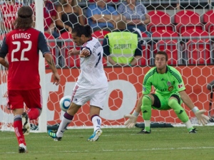 Real Salt Lake's Fabian Espindola (centre) has a shot on goal as Toronto FC 's Torsten Frings (left) and Milos Kocic look on during first half MLS action in Toronto on Saturday August 13, 2011. THE CANADIAN PRESS/Chris Young