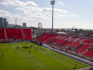 The fair ground rides of the CNE stand behind empty seats during Toronto FC's CONCACAF Champions League game against FC Dallas in Toronto on Thursday, Aug. 25, 2011. The game is being replayed after being abandoned because of Wednesday night's thunderstorms. (THE CANADIAN PRESS/Chris Young)