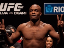 Brazilian Mixed Martial Arts (MMA) fighter Anderson Silva, current Ultimate Fighting Championship (UFC) middleweight champion, poses for photos during the weigh-in for his fight against Yushin Okami in Rio de Janeiro, Brazil, Friday Aug. 26, 2011. (AP Photo/Felipe Dana)