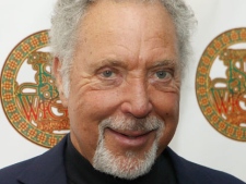 In this June 11, 2011 file photo, Welsh singer Tom Jones is seen at the Isle of Wight music festival. Jones has canceled a concert in Monte Carlo, saying doctors diagnosed him with severe dehydration and ordered him not to take the stage. The Saturday, Aug. 28, 2011 concert was to have been 71-year-old singer's final show of a 3-month "Praise & Blame" tour. (AP Photo/Joel Ryan)