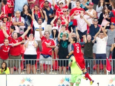 Toronto FC's Eric Avila, bottom right, leaps in the air while celebrating his first half goal in front of fans in a MLS soccer match against the San Jose Earthquakes in Toronto Saturday, August 27, 2011. (THE CANADIAN PRESS/Darren Calabrese)