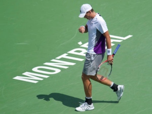 Canada's Vasek Pospisil racts during his match against Roger Federer from Switzerland during second round of play at the Rogers Cup tennis tournament Wednesday, August 10, 2011 in Montreal. Federer won 7-5, 6-3. (THE CANADIAN PRESS/Paul Chiasson)