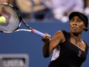 Venus Williams, of the United States, returns against Vesna Dolonts, of Russia, during the first round of the U.S. Open tennis tournament in New York, Monday, Aug. 29, 2011. (AP Photo/Charles Krupa)