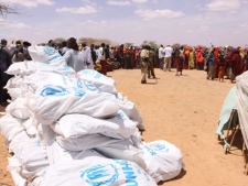 Somali refugees wait for food distribution from UNHCR in Dollow Refugee camp in southern Somalia Tuesday. Aug. 30. 2011. Despite the drought and famine, refugees in Somalia are celebrating the Muslim holiday of Eid al-Fitr with the food rations distributed by aid agencies for their survival. (AP Photo/Khalil Senosi)