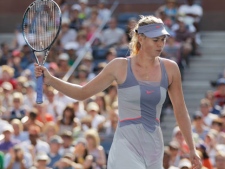 Maria Sharapova of Russia reacts during her match against Flavia Pennetta of Italy during the U.S. Open tennis tournament in New York, Friday, Sept. 2, 2011. (AP Photo/Charlie Riedel) 