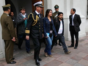 A presidential aide, front left, escorts Chile's student leaders Camila Vallejo, front center, Giorgio Jackson, back left, and Patricio Contreras, second right, as they arrive at La Moneda government palace to hold a meeting with Chile's President Sebastian Pinera in Santiago, Chile, Saturday, Sept. 3, 2011. In the last trimester, Chilean students have been holding a campaign demanding free and better education. (AP Photo/Roberto Candia)