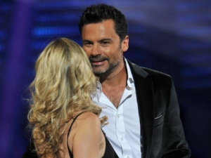 In this photo taken Feb. 23, 2010, Chilean entertainer Felipe Camiroaga embraces Soledad Onetto during the 51th Vina del Mar International Song Festival in Vina del Mar, Chile. An official says a Chilean air force plane has crashed in the Juan Fernandez islands off Chile's Pacific coast with 21 people aboard, including Camiroaga, one of Chile's most popular television presenters. (AP Photo/Jorge Sanchez)