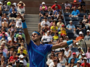 Rafael Nadal of Spain serves to David Nalbandian of Argentina during the U.S. Open tennis tournament in New York, Sunday, Sept. 4, 2011. (AP Photo/Charlie Riedel)