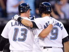 Toronto Blue Jays' J.P. Arencibia, right, and Brett Lawrie celebrate Arencibia's three-run home run in the second inning of MLB baseball action against the Boston Red Sox in Toronto Thursday, September 8, 2011. (THE CANADIAN PRESS/Darren Calabrese)