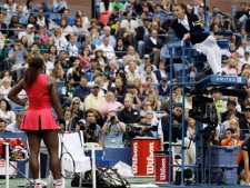 Serena Williams, left, argues with chair umpire Eva Asderaki during the women's championship match against Samantha Stosur of Australia at the U.S. Open tennis tournament in New York, Sunday, Sept. 11, 2011. (AP Photo/Matt Slocum)