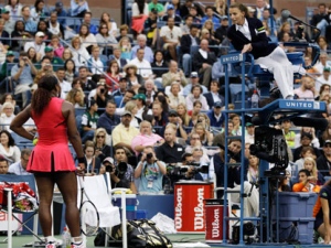 Serena Williams, left, argues with chair umpire Eva Asderaki during the women's championship match against Samantha Stosur of Australia at the U.S. Open tennis tournament in New York, Sunday, Sept. 11, 2011. (AP Photo/Matt Slocum)