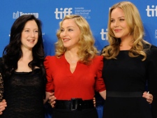 Actress Andrea Riseborough, from left, director and singer Madonna, and actress Abbie Cornish participate in a news conference for the film "W.E." during the Toronto International Film Festival on Monday, Sept. 12, 2011 in Toronto. (AP Photo/Evan Agostini)