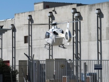 Rescuers and medics land by helicopter in the nuclear site of Marcoule, France, Monday, Sept. 12, 2011. One person died and another was seriously injured in an explosion in a site that treats nuclear waste in southern France, the country's nuclear safety body said, adding that no radioactive leaks have been detected. (AP Photo/Claude Paris)