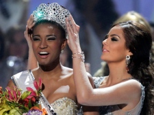 Miss Angola Leila Lopes is crowned Miss Universe 2011 by Miss Universe 2010 Ximena Navarrete, of Mexico, in Sao Paulo, Brazil, Monday Sept. 12, 2011. (AP Photo/Andre Penner)