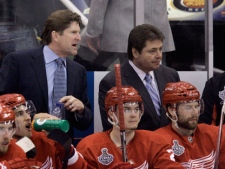  In this May 30, 2009, file photo, Detroit Red Wings head coach Mike Babcock, rear left, and assistant coach Brad McCrimmon, rear right, watch as their team plays the Pittsburgh Penguins in Game 1 of the NHL Stanley Cup finals hockey series in Detroit. A Russian jet carrying a top ice hockey team crashed just after takeoff Wednesday, Sept. 7, 2011, killing at least 43 people, including McCrimmon, and leaving two others critically injured. (AP Photo/Carlos Osorio, File)