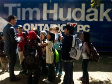 Students talk with Ontario Conservative leader Tim Hudak as he makes a non-media stop on his election campaign at Queen's Park in Toronto on Thursday, Sept., 15, 2011. (THE CANADIAN PRESS/Nathan Denette)