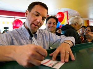 PC Leader Tim Hudak fills out his customer election polling paper at Lick's during a campaign event in Toronto on Friday, Sept.16, 2011. THE CANADIAN PRESS/Nathan Denette