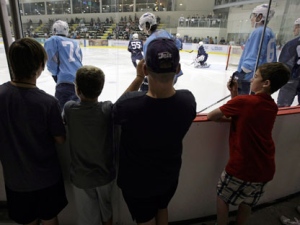 Young Winnipeg Jets fans look on during the first practice of rookie camp at MTS Iceplex in Winnipeg on Saturday Sept. 10, 2011. THE CANADIAN PRESS/Trevor Hagan