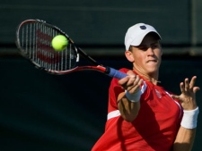 Canada's Vasek Pospisil returns a shoot to Israel's Andy Ram and Jonathan Erlich during their doubles Davis Cup World Group playoff Tennis match in Ramat Hasharon near Tel Aviv, Israel Tel Aviv, Israel,Saturday, Sept. 17, 2011 . (AP Photo/Ariel Schalit)