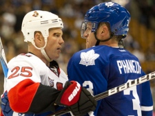 Toronto Maple Leafs Dion Phaneuf (right) and Ottawa Senators Chris Neil engage in a stare down at the end of third period NHL pre-season action in Toronto on Monday September 19, 2011. (THE CANADIAN PRESS/Frank Gunn)