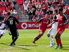 Toronto FC 's Danny Koevermans (centre) turns to celebrate scoring Toronto's opening goal as Colorado Rapids' Miguel Comminges (left) Matt Pickens (centre left) Drew Moore (centre right) and Toronto's Ryan Johnson look on during second half MLS action in Toronto on Saturday September 17, 2011. (THE CANADIAN PRESS/Chris Young)