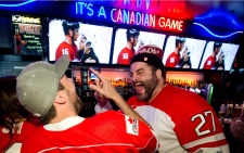 Canaidan fans cheer Team Canada hockey Sochi