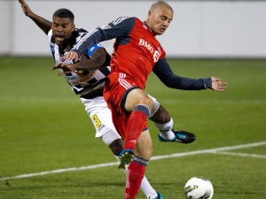 Toronto FC's Danny Koevermans (right) and Tauro FC's Luis Moreno battle for the ball during first half CONCACAF action in Toronto on Tuesday September 20, 2011. (THE CANADIAN PRESS/Frank Gunn)