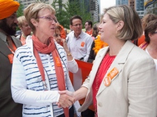 Ontario NDP Leader Andrea Horwath, right, and interim Federal NDP Leader Nycole Turmel shake hands before marching in Toronto's Labour Day parade in memory of Jack Layton Monday, September 5, 2011. THE CANADIAN PRESS/Darren Calabrese