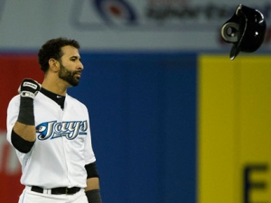 Toronto Blue Jays right fielder Jose Bautista throws his helmet off after hitting a pop up out against the Los Angeles Angels during first inning AL baseball action in Toronto on Wednesday, Sept. 21, 2011. (THE CANADIAN PRESS/Nathan Denette)