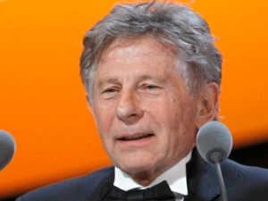 This is a Friday, Feb. 25, 2011, file photo of film director Roman Polanski as he speaks after receiving the Best Adaptation award for his film "The Ghost Writer" during the 36th Cesar Awards ceremony in Paris. (AP Photo/Jacques Brinon)