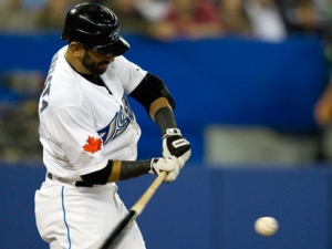 Toronto Blue Jays Jose Bautista hits a RBI single during fifth inning AL action against the Los Angeles Angels in Toronto on Thursday September 22, 2011. (THE CANADIAN PRESS/Frank Gunn)